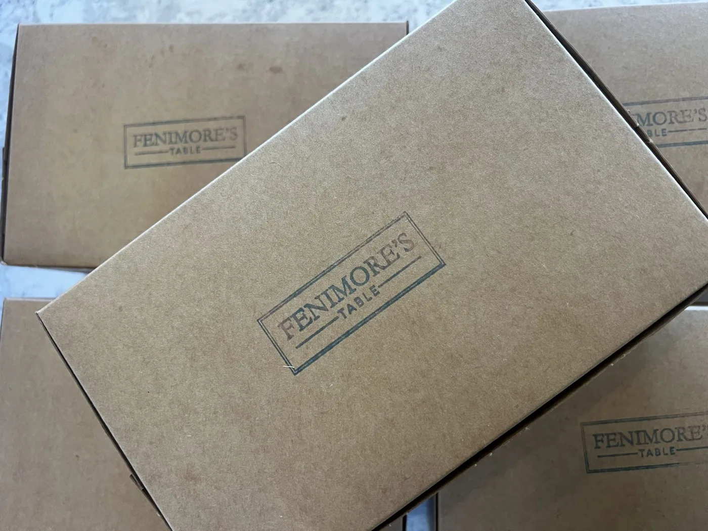 Kraft catering boxes stamped with the Fenimore's Table logo Kraft catering boxes stamped with the Fenimore's Table logo